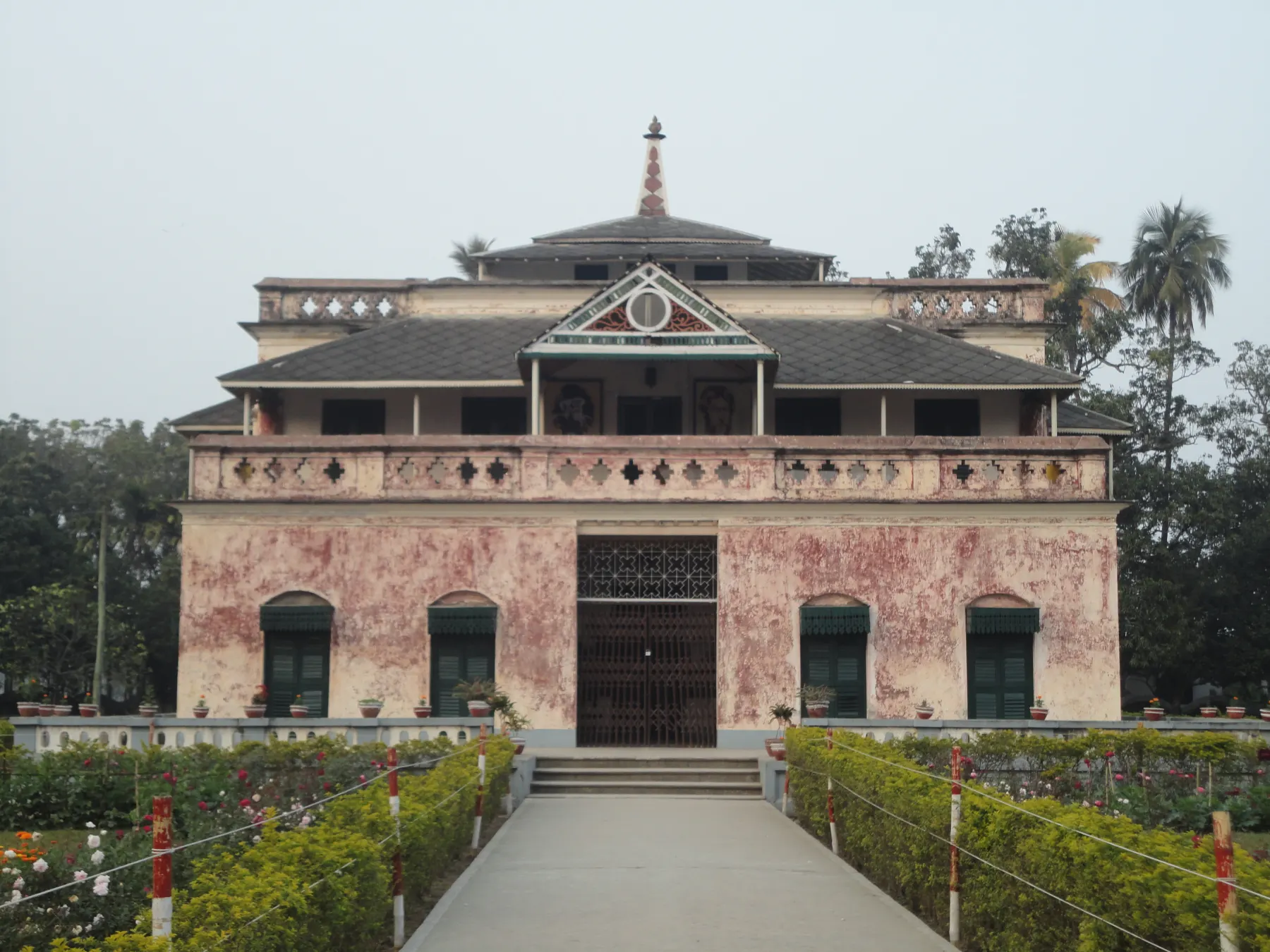 Red Shilaidaha Kuthibari house surrounded by trees in Kushtia